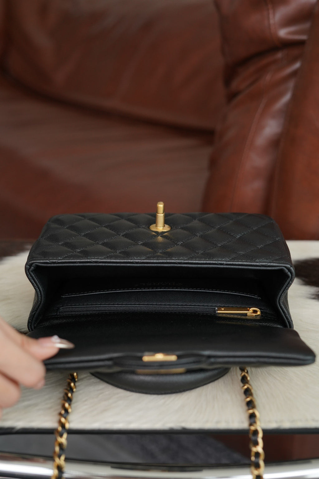 Chanel quilted black flap handbag opened front with gold latch