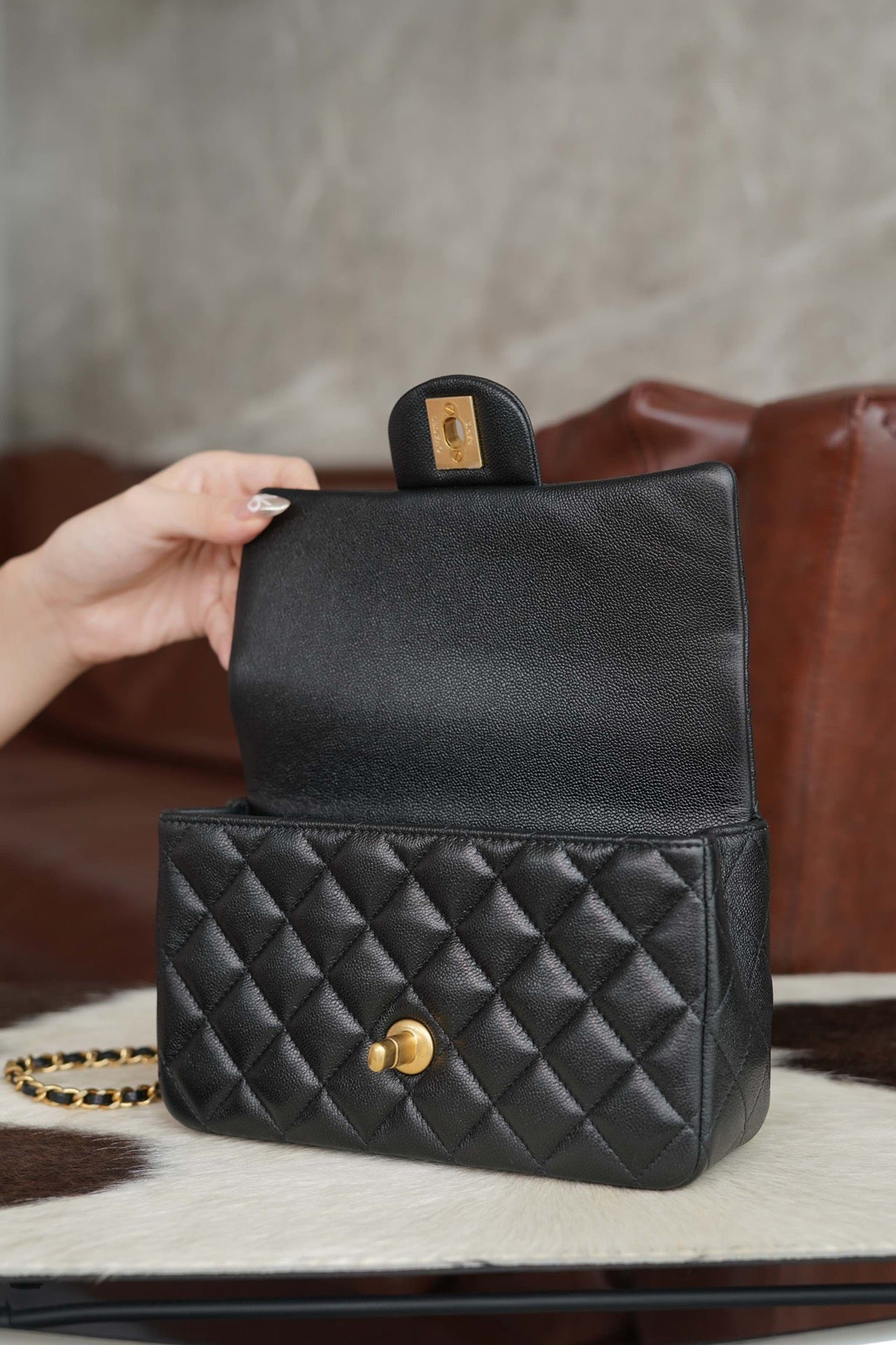 Chanel quilted black small boxy bag with front flap and gold accents
