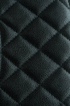 Chanel quilted black leather pattern close-up with diamond stitching