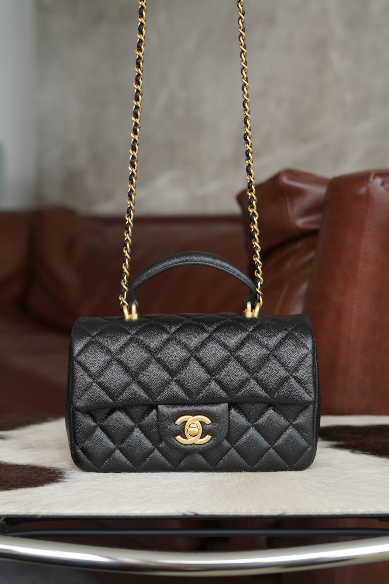Chanel quilted black flap crossbody bag with gold chain and CC emblem