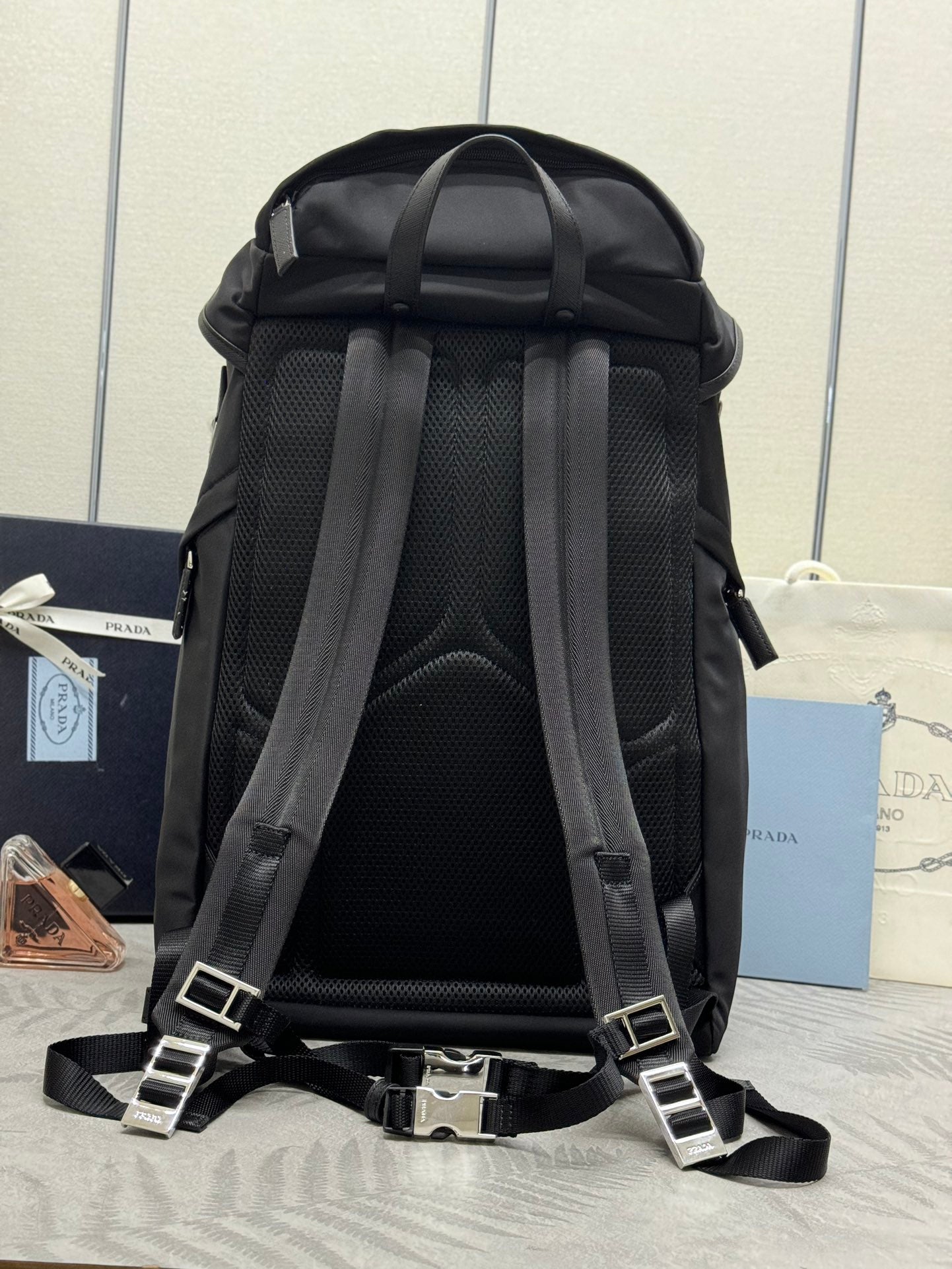 Prada black backpack with padded back panel and adjustable shoulder straps