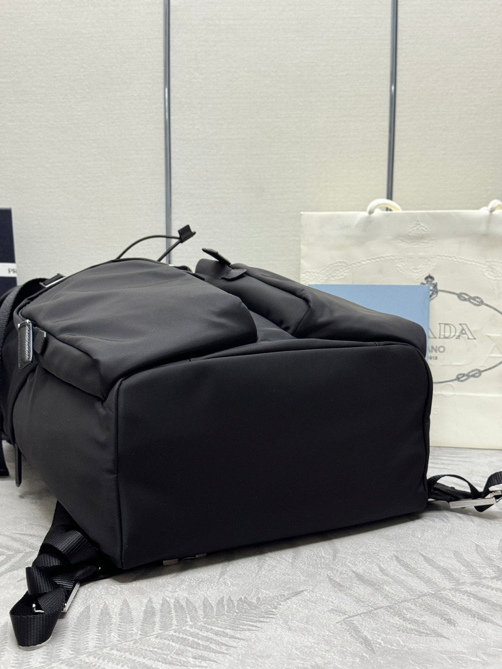 Prada black nylon duffel-style bag with side zip and strap handles