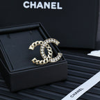 Gold-tone chain bracelet with interlocking C and clear rhinestone border