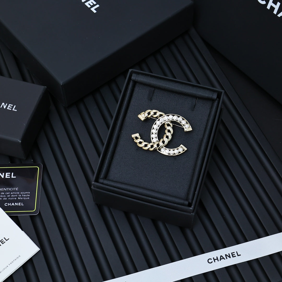 Gold-tone chain bracelet with rhinestone interlocking C clasp detail