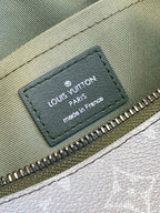 Louis Vuitton Paris leather patch and zipper on green monogram wristlet bag