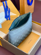 Small Louis Vuitton monogram clutch bag, open top with green interior, dark gray