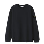 Black long-sleeve crewneck top with small side logo patch