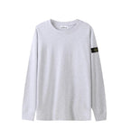 Light grey long-sleeve crewneck top with side logo patch