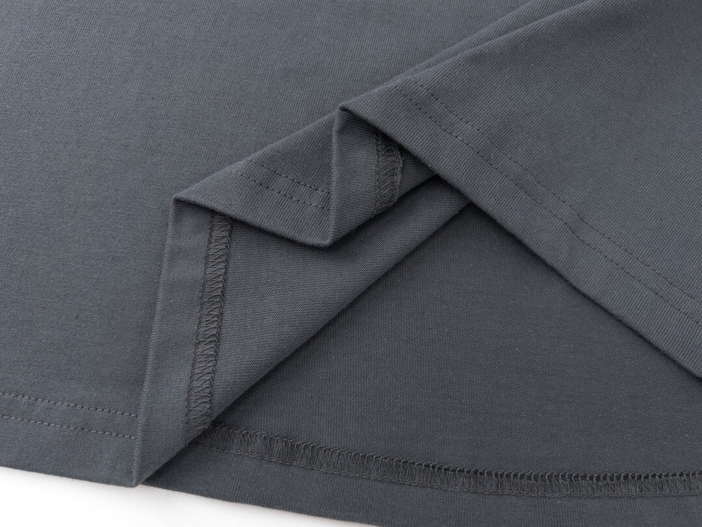 Grey sweatshirt sleeve cuff and hem stitching detail