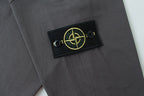 Dark grey sweatshirt chest logo patch with yellow emblem