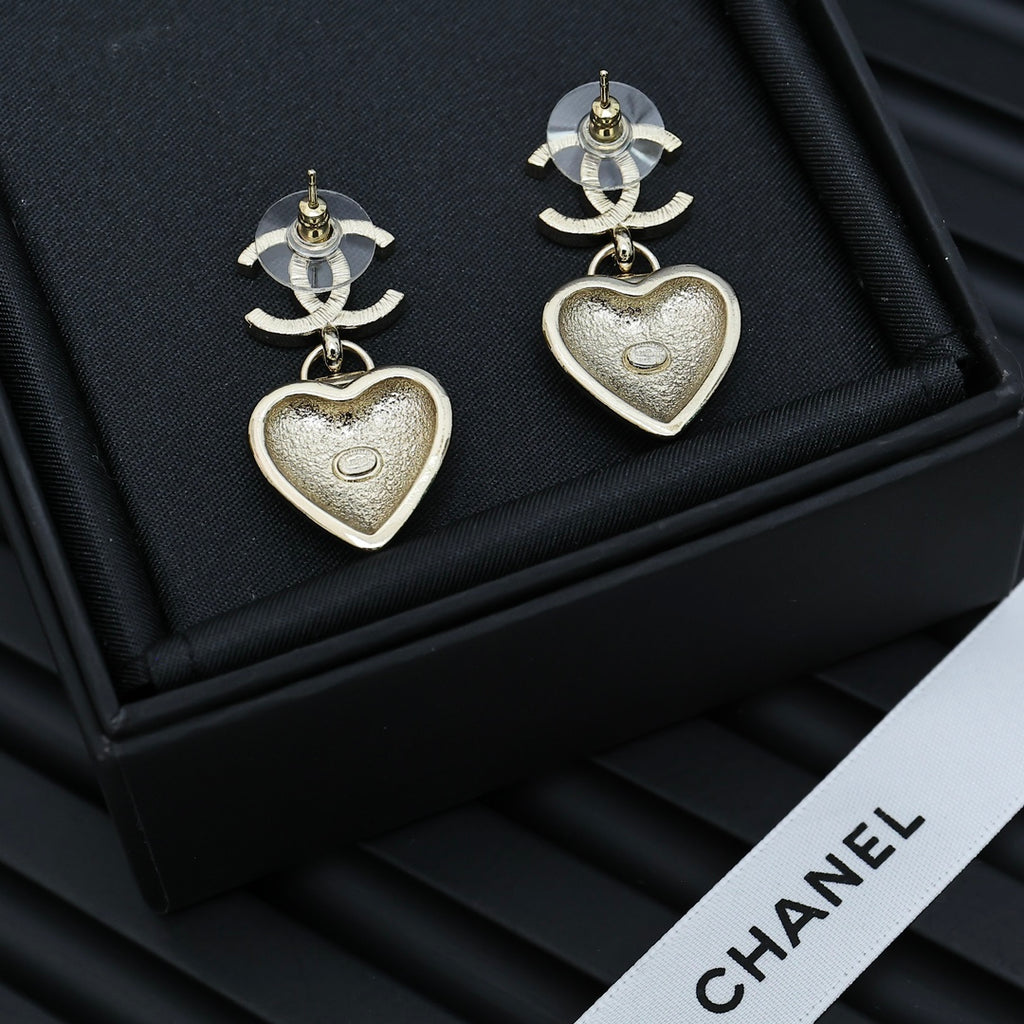 Chanel heart drop earrings with silver CC tops and silver heart charms