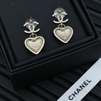 Chanel heart drop earrings with silver CC tops and silver heart charms