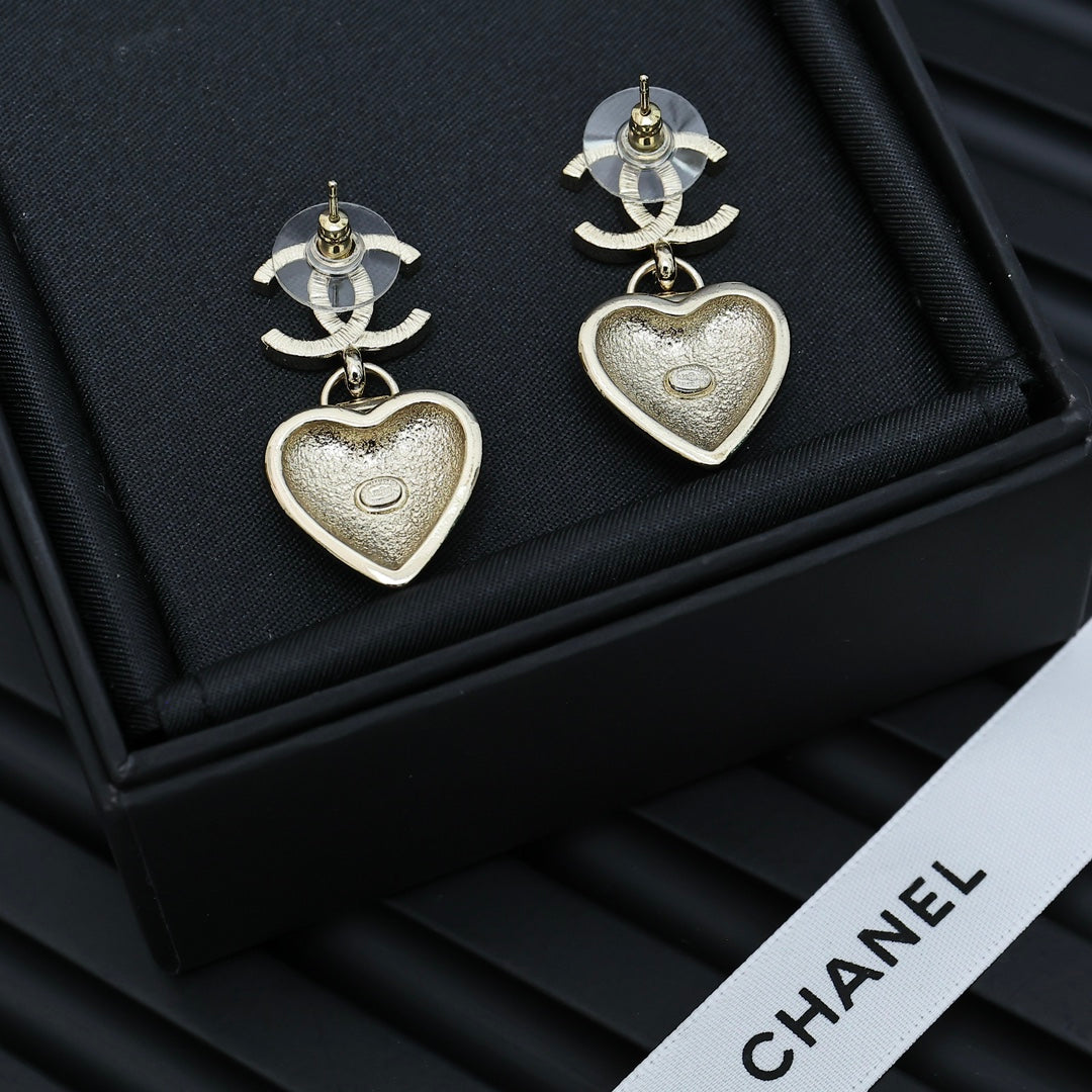 Chanel heart drop earrings with silver CC tops and silver heart charms