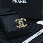 Chanel jeweled CC-style brooch with gold-tone metal and clear crystal details
