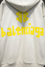 Off-white hoodie with hood and large yellow back graphic logo