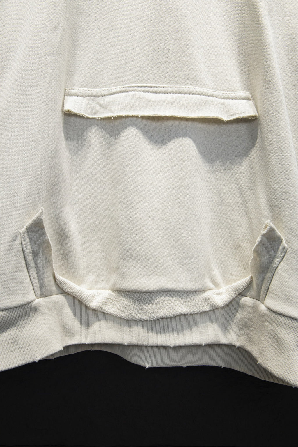 Off-white hoodie kangaroo pocket with curved cutout opening