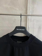 Black crew-neck T-shirt with Balenciaga neckline label