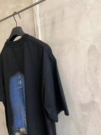 Black T-shirt with blue column graphic on back
