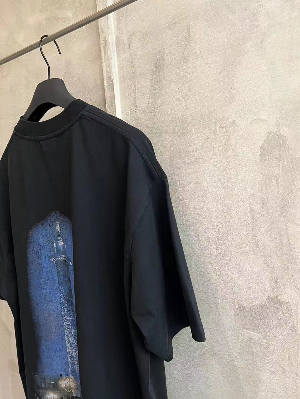 Black Balenciaga short-sleeve T-shirt with blue Eiffel tower graphic on back