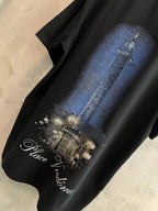 Black T-shirt with blue column graphic and Place Vendome script
