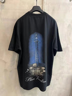 Black crew-neck T-shirt with blue column graphic and Place Vendome text