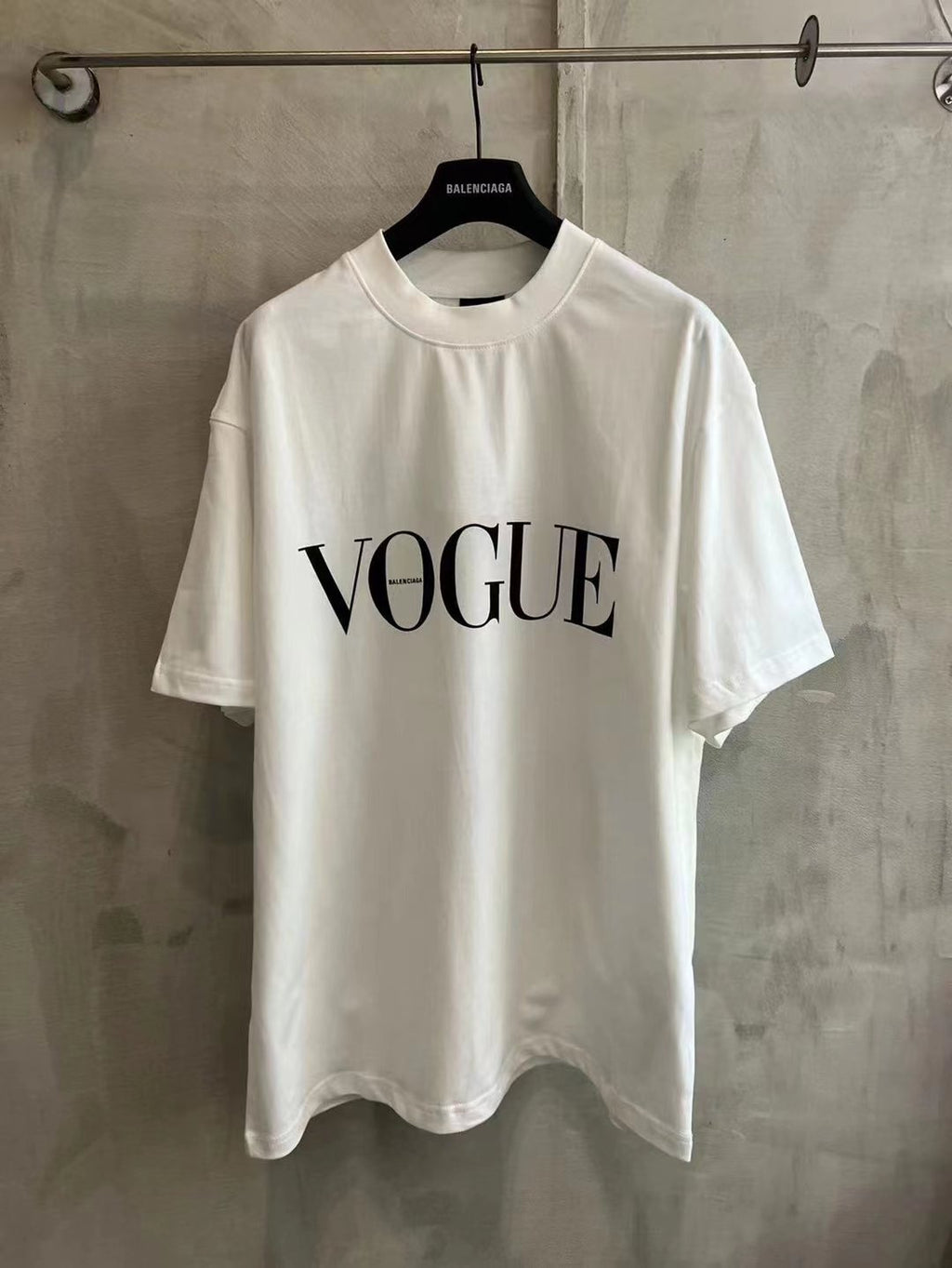 White short-sleeve T-shirt with bold "VOGUE" front print