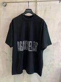Black crew-neck T-shirt with large distressed “AGAINST” graphic print on the front