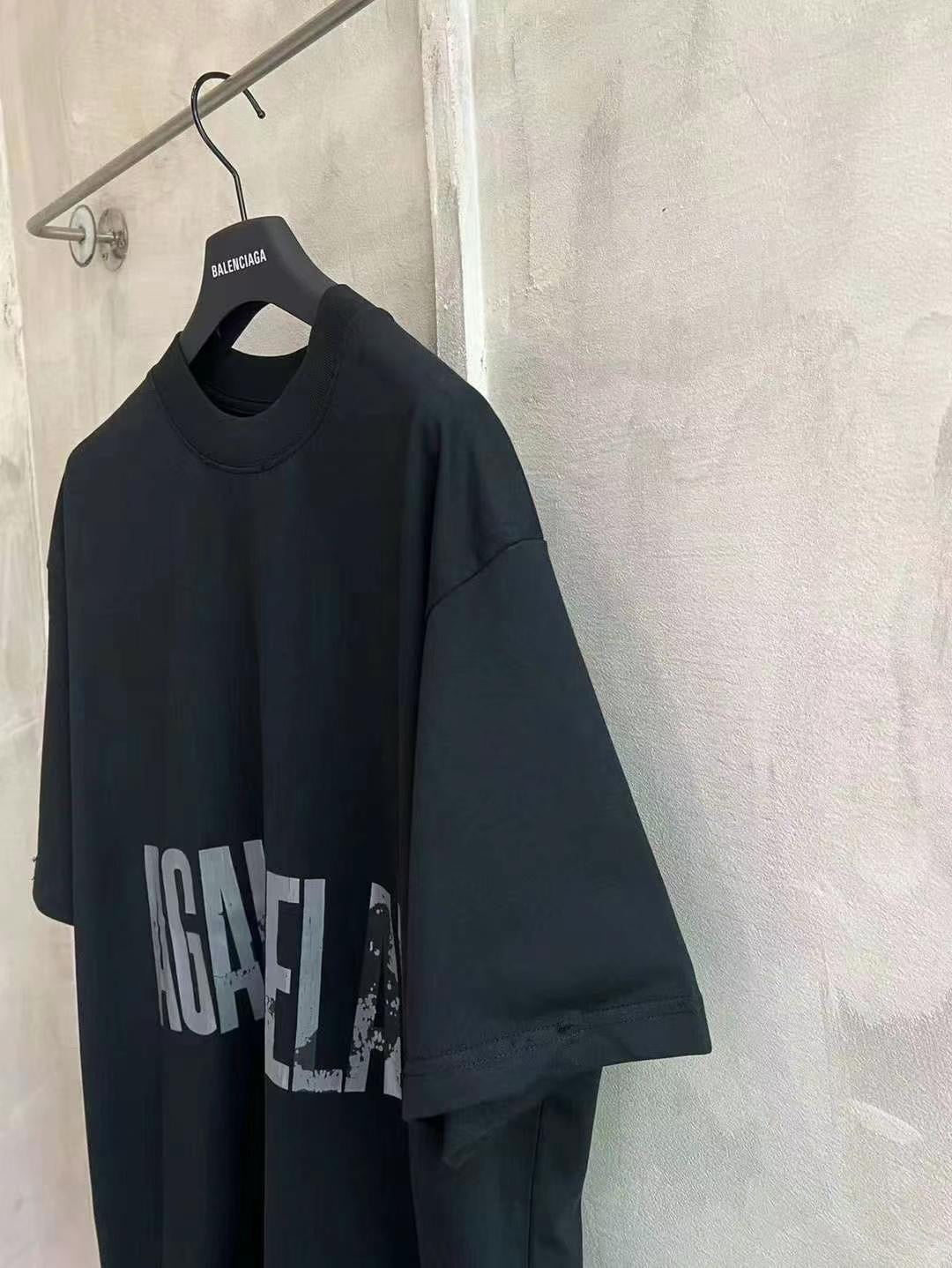 Black crew-neck T-shirt with large distressed “AGAINST” graphic print