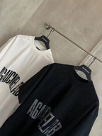 Balenciaga graphic T-shirts set: white and black, both with AGAINCELAB logo text