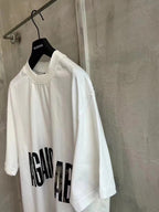 Balenciaga white graphic T-shirt with AGAINCELAB logo text on the sleeve area