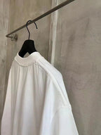 Balenciaga white T-shirt back view with crew neck and plain lower hem
