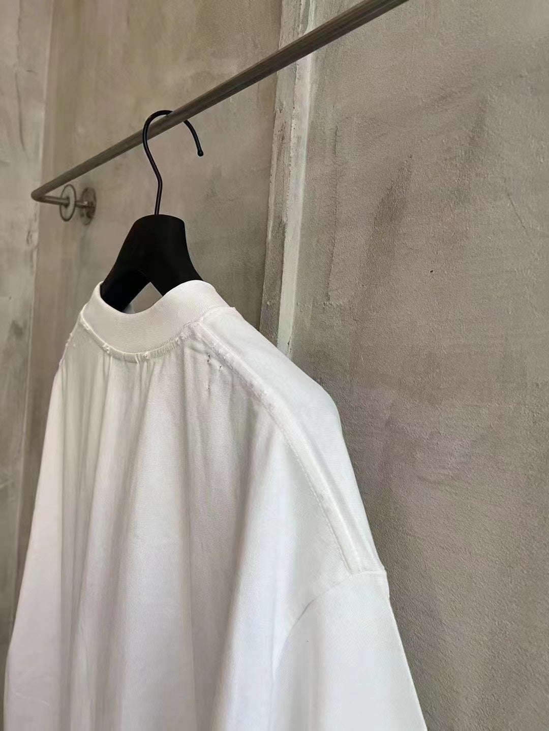 Balenciaga white T-shirt back view with crew neck and plain lower hem