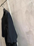 Balenciaga dark blue T-shirt with crew neck and front graphic, side view