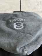 Back of heather gray hood with BALENCIAGA 8 logo on dark jacket