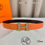 Orange leather belt with silver-tone H buckle