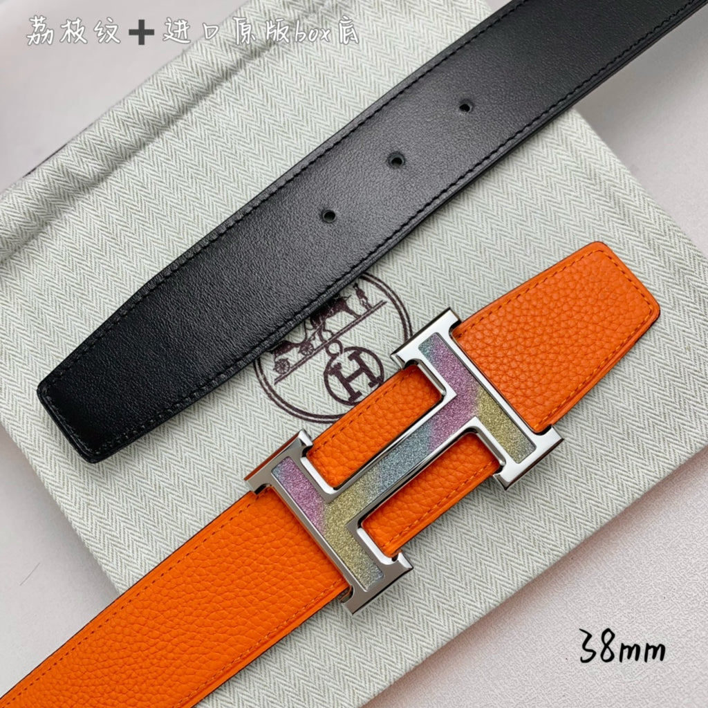 Orange belt with black leather strap with holes and silver-tone H buckle detail