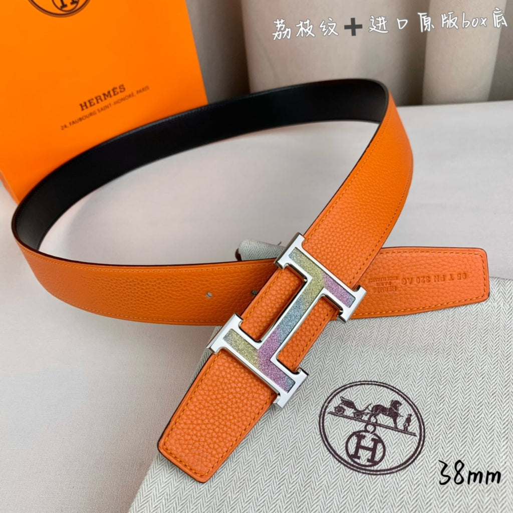 Orange leather belt with silver-tone H buckle and attached black strap
