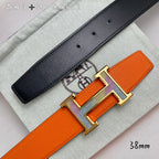 Orange belt with black leather strap with holes and silver-tone H buckle