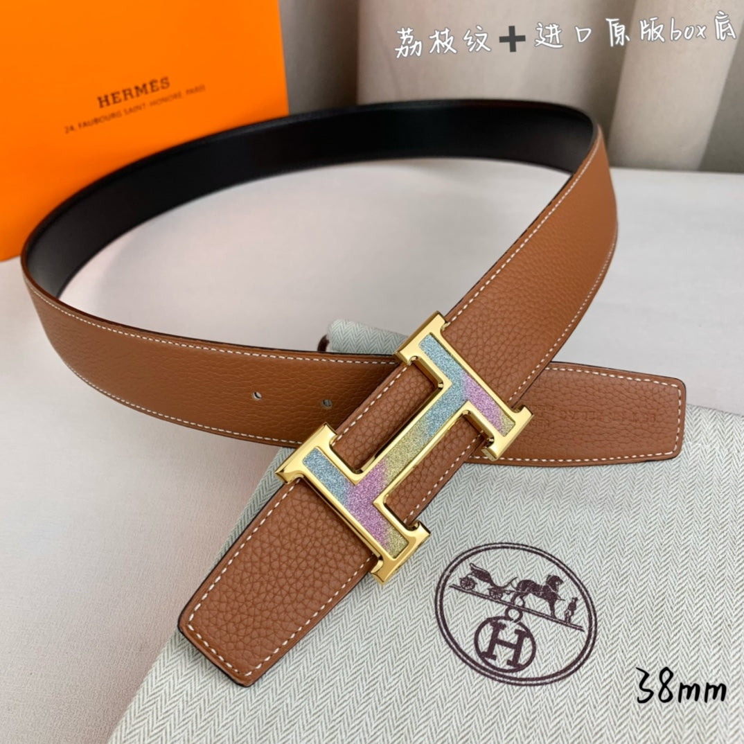 Tan leather belt with gold-tone and silver-tone H buckle, adjustable holes