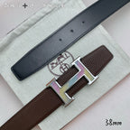 Two-tone leather belt with gold H buckle and dark strap with brown keeper tab