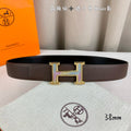 Brown leather belt with gold H buckle and leather keeper tab
