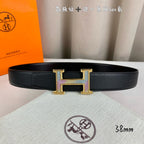 Hermes leather belt, black textured strap with gold H buckle and purple accents