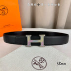 Leather belt, black textured strap with gold H buckle and purple side inlays