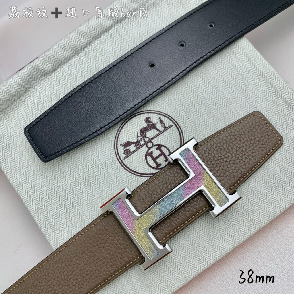 Hermes belt with black leather strap and silver H buckle with studs