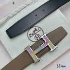 Hermes belt with black leather strap and silver H buckle with studs