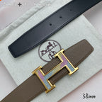 Hermes belt with black leather strap and gold H buckle with studs