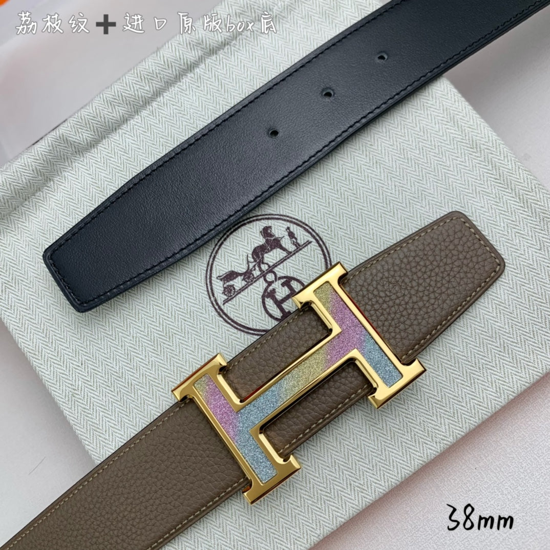 Hermes belt with black leather strap and gold H buckle with studs