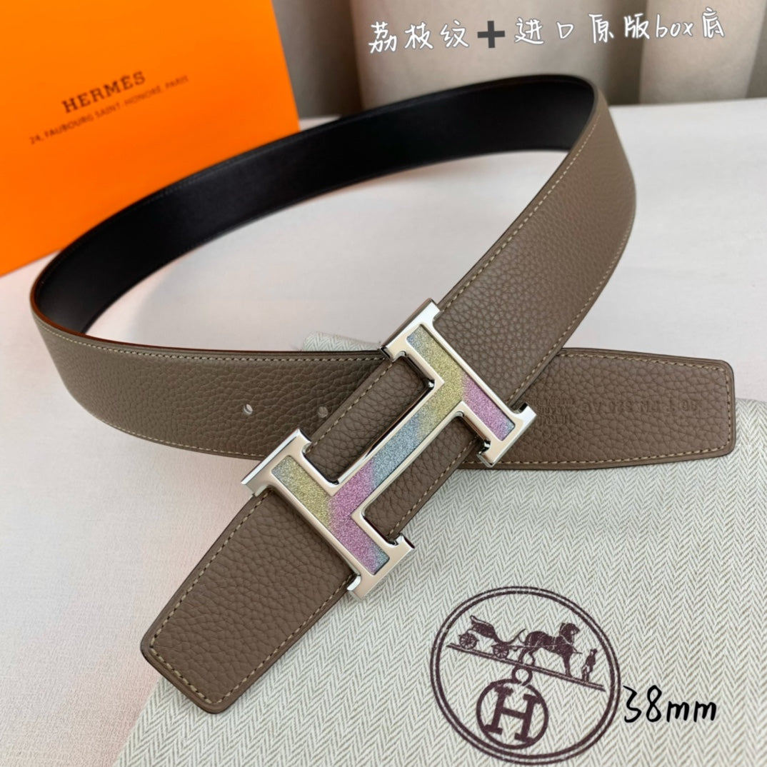 Hermes belt with brown leather strap and silver H buckle with iridescent detail