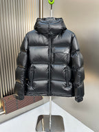 Prada hooded long puffer jacket in dark color, quilted panels and front zipper