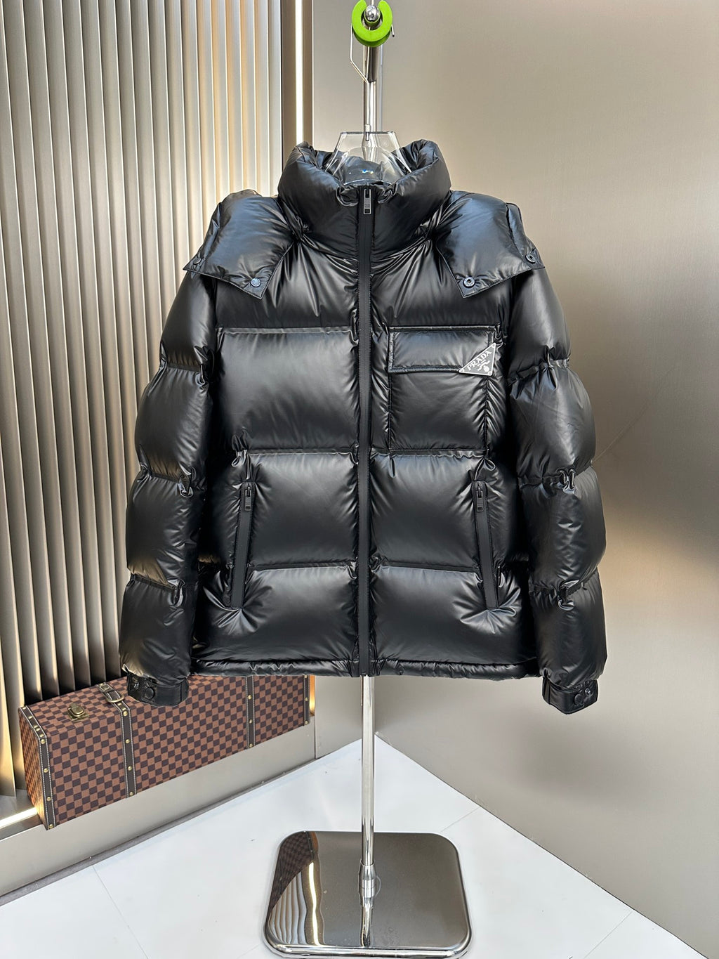 Prada long puffer jacket with hood, dark finish, front zipper and padded pockets